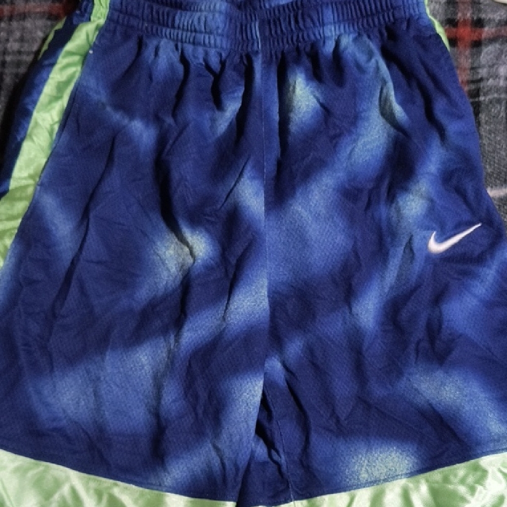 Nike Blue Athletic Shorts with Light Green Trim and White Swoosh